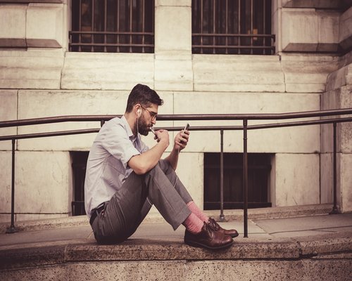person reading on smartphone during local commute